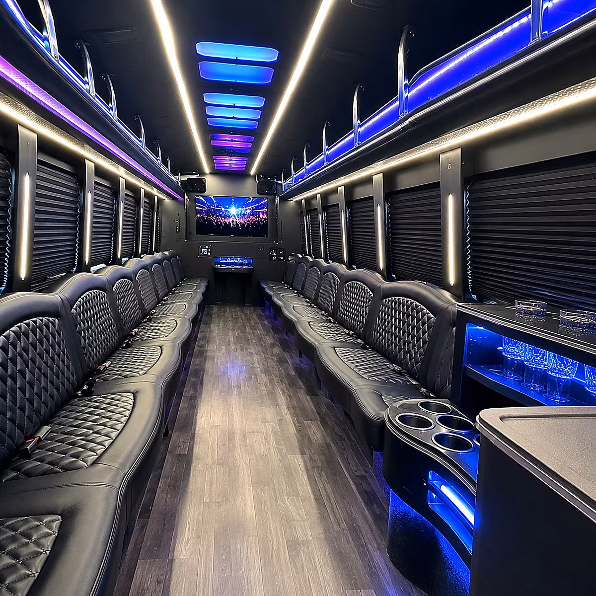 Friends laughing during a party bus celebration in Cincinnati